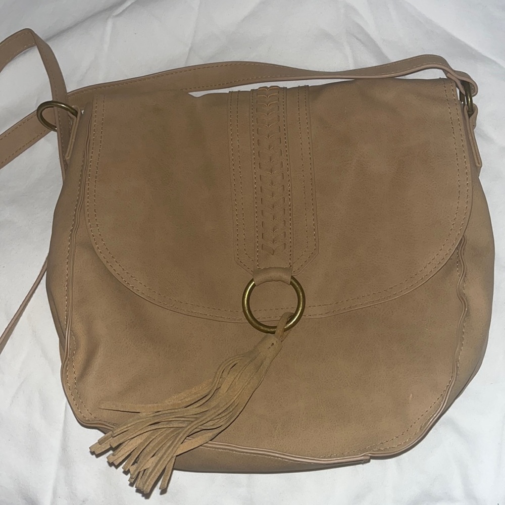 This is a tan hand bag never worn.